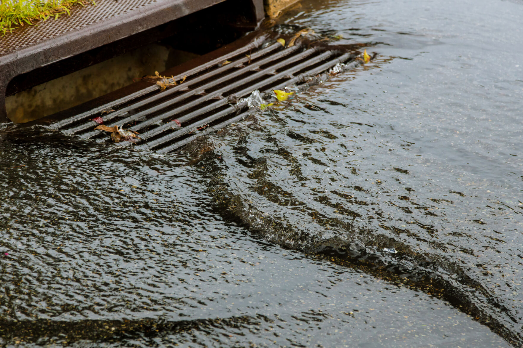 Water gushing from storm sewer following very heavy rainfall